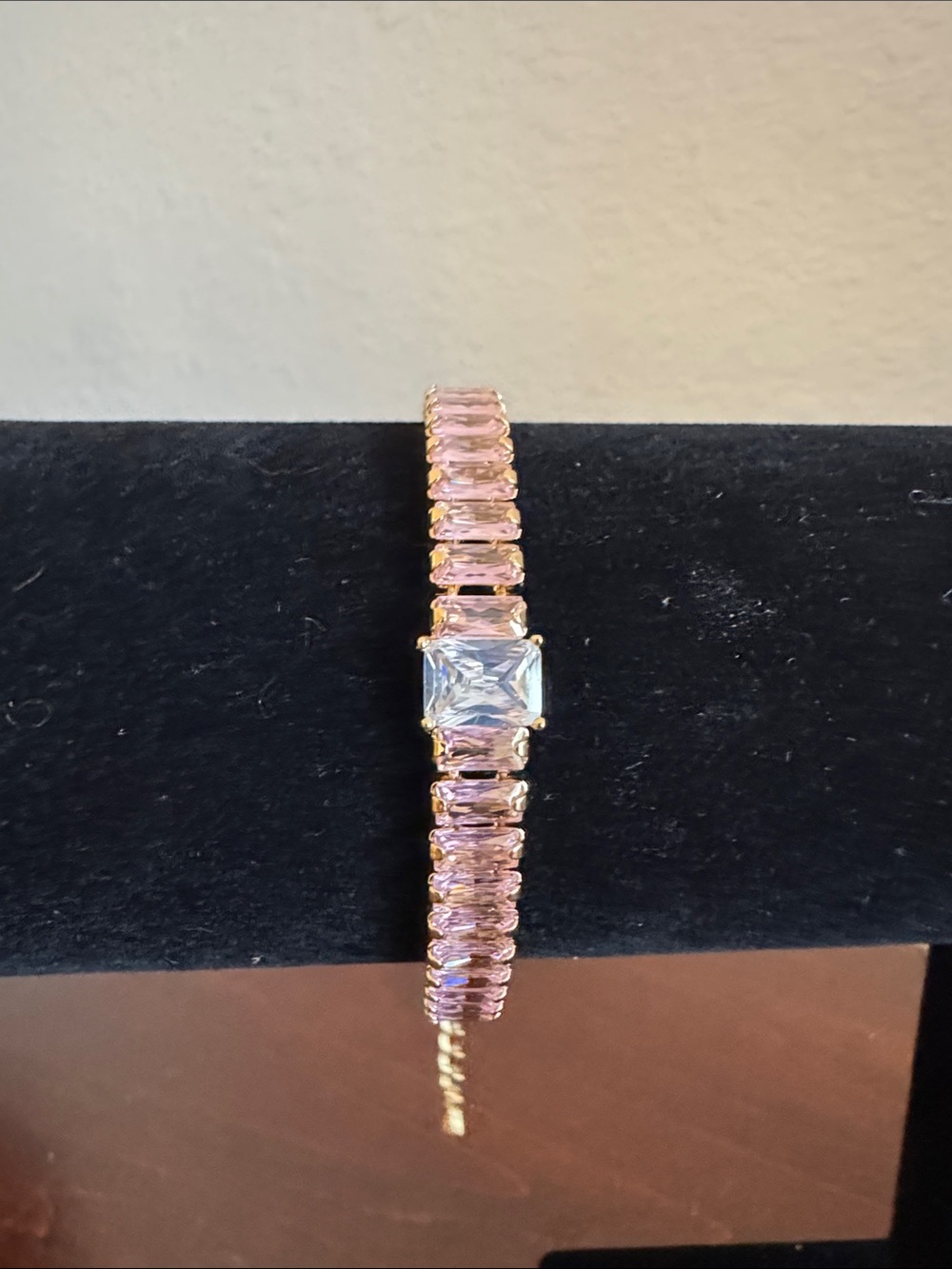 Pink cubic zirconia gold plated tennis bracelet & larger clear stone